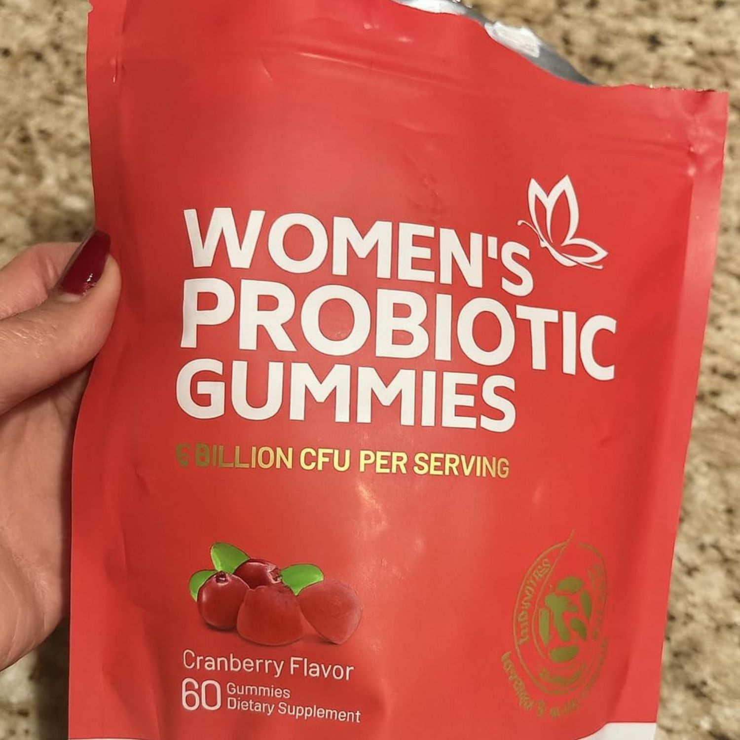 Customer holding Feminine Balance Women's Probiotic Gummies pouch